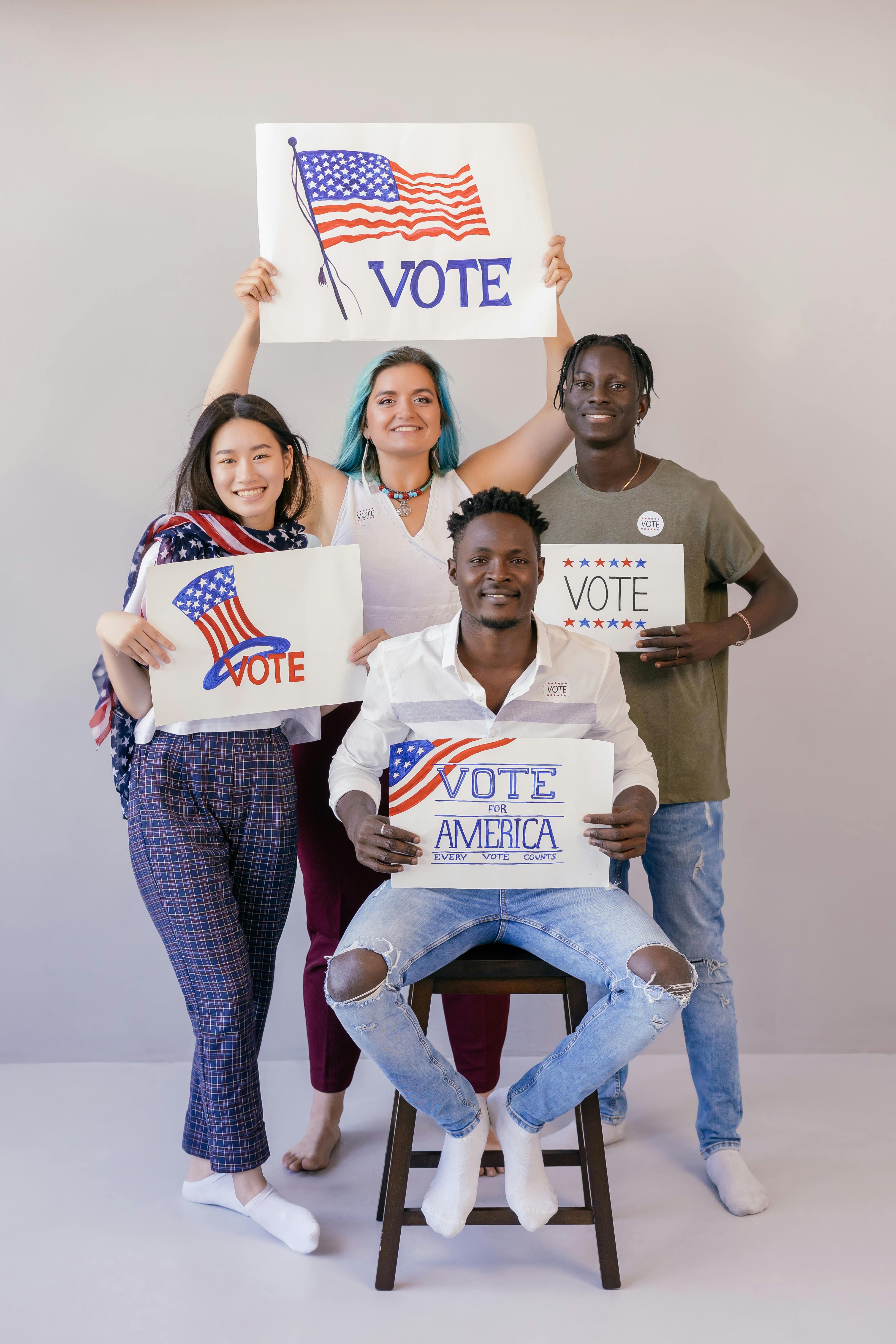 group of people holding election banners