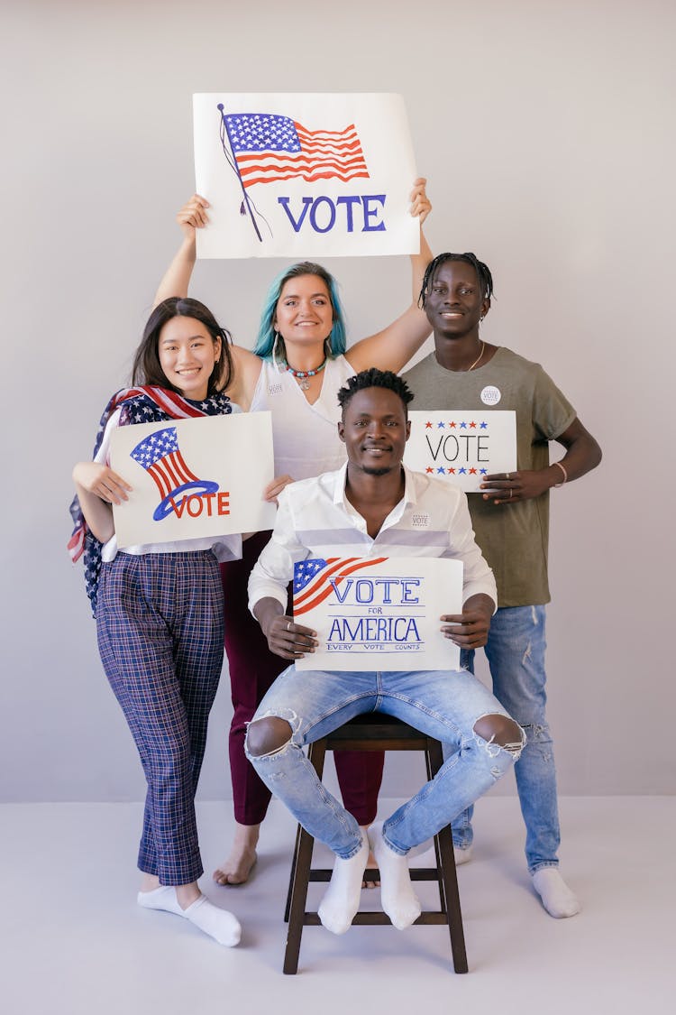 Group Of People Holding Election Banners