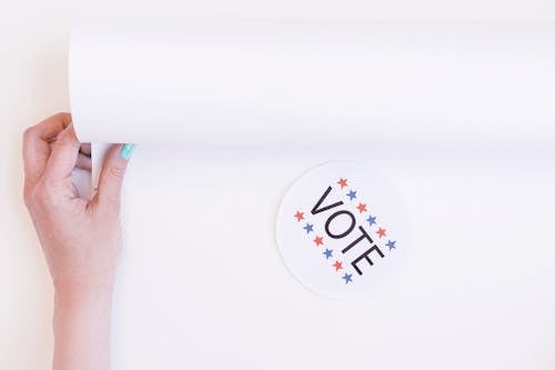 Vote Badge on White Surface