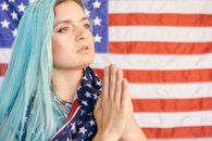Close Up Photo of Woman Faithfully Praying