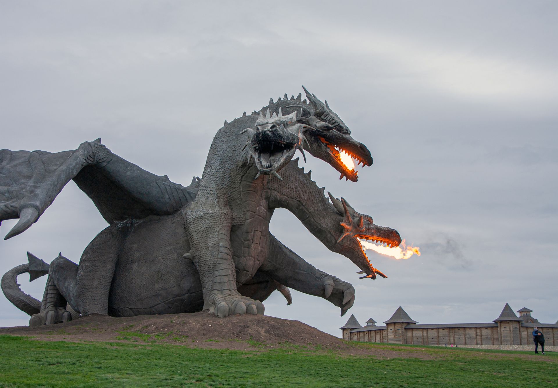 A Triple Head Dragon Sculpture in a Park