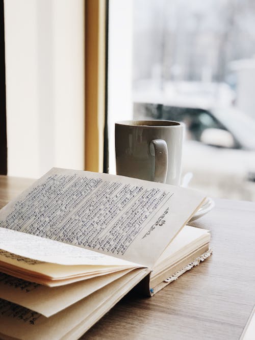 Book Beside a Mug