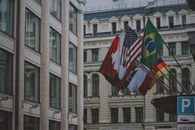 Flags on Poles in Front of Building