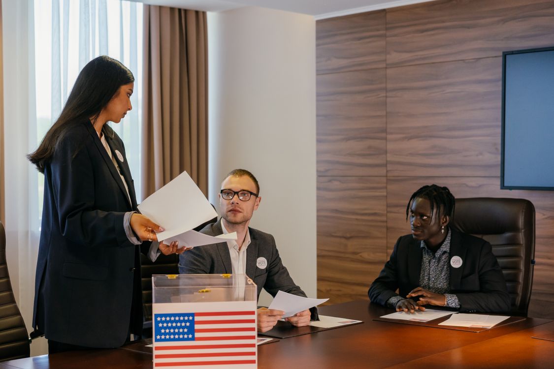 Government officials deliberating at a city council meeting