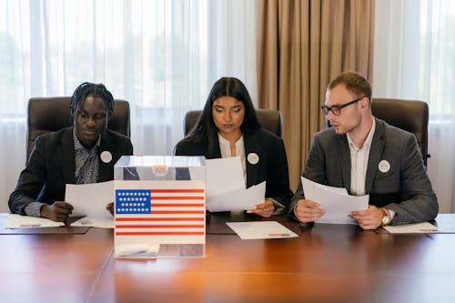 Politicians Sitting Beside Wooden Table