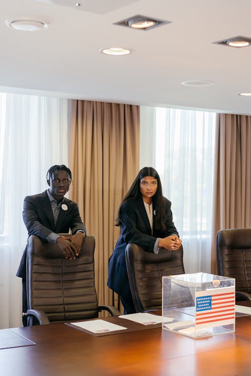 Politicians Standing Behind Armchair