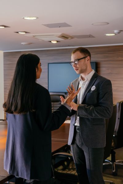 Teammates talking in the studio — photo by Mikhail Nilov on Pexels