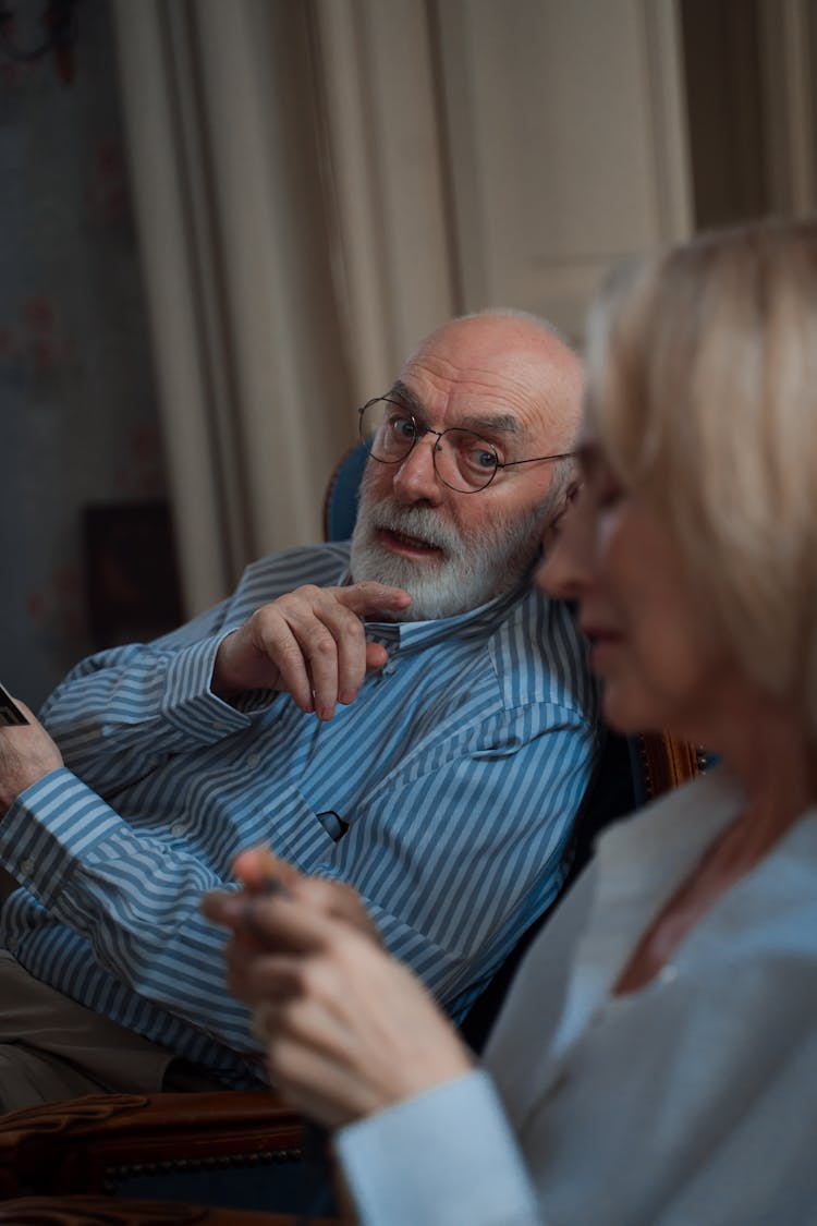 An Elderly Man Talking While Pointing His Finger