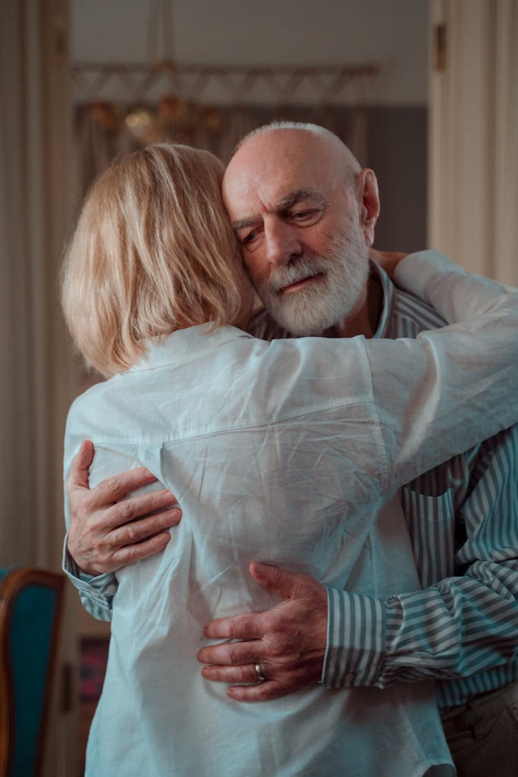 Photo Of An Elderly Couple Hugging