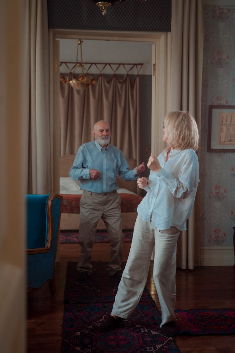 An Elderly Couple Dancing Together