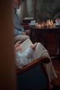 Person in White Long Sleeve Shirt Reading Book