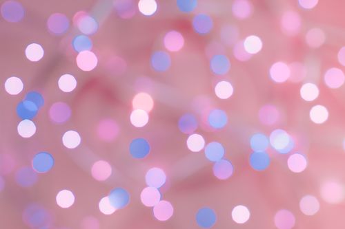 Free Soft-focus bokeh lights in pink and blue create a dreamy abstract background. Stock Photo
