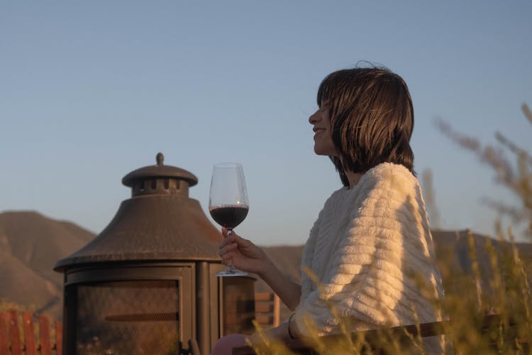 Woman Holding Wine Glass Outdoors