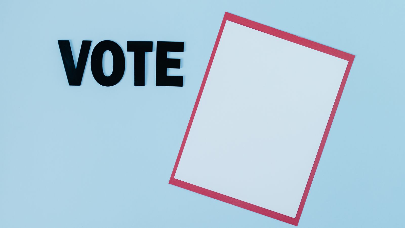 Simple conceptual image featuring the word 'VOTE' and blank paper, ideal for election themes.