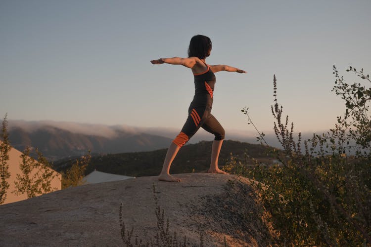 A Woman Doing A Warrior II Pose