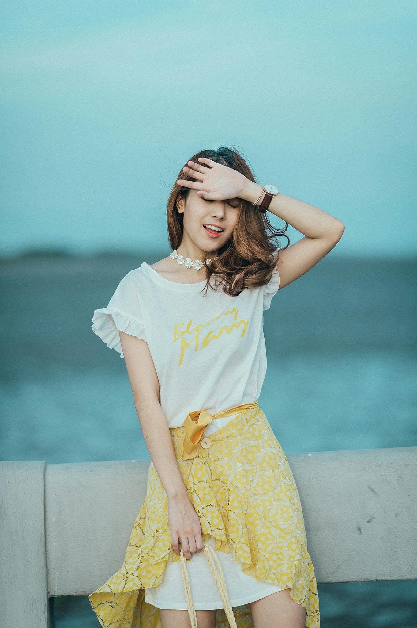 woman wearing white and yellow scoop neck mini dress