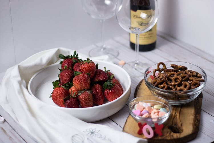 Close-Up Shot Of Snacks And Fruits On A Bowl