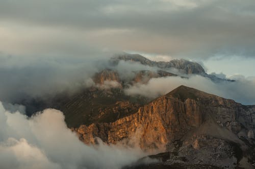 Foggy Landscape of the Mountains at Sunset 