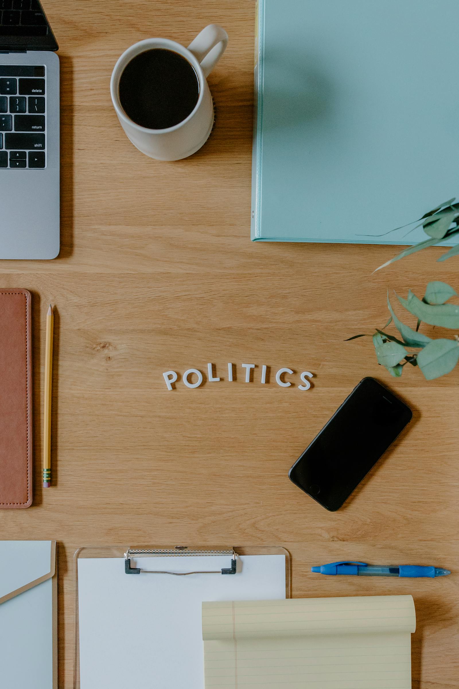 Organized desk with stationery and mug