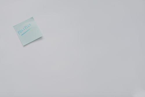 Free A simple sticky note with 'politics' written on it, offering ample copyspace. Stock Photo