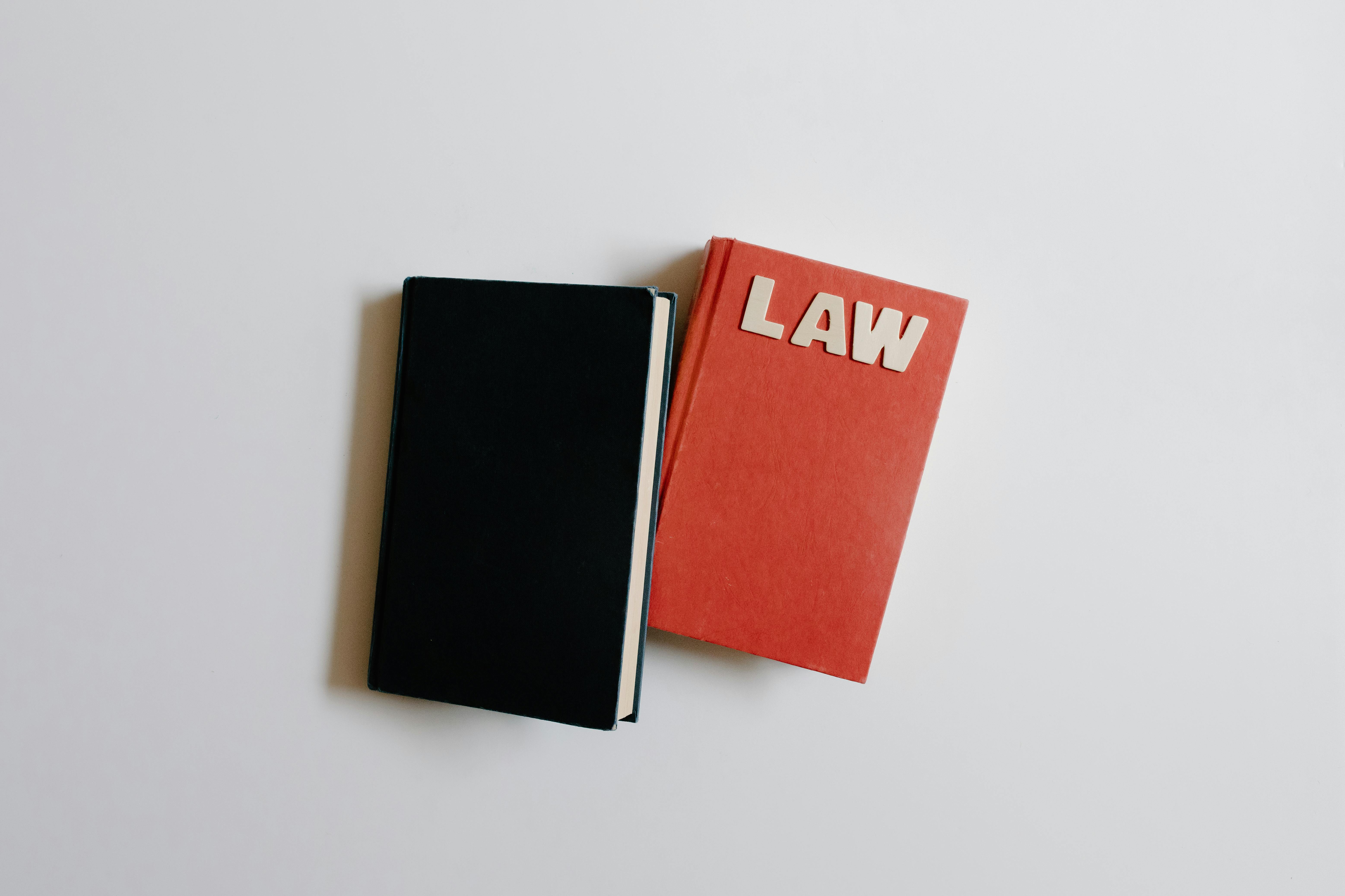 top view of notebooks with a text law on the cover