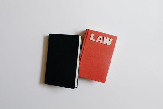 Top View of Notebooks with a Text "Law" on the Cover