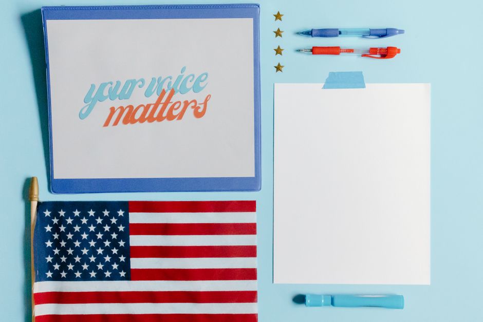 Find Your Voice 4th Annual Gala Raises Support for South Florida Arts 2 Patriotic flat lay featuring an American flag and a motivational 'Your Voice Matters' card. | BocaVibe