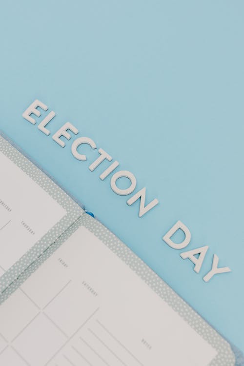 Free Election Day Words on a Blue Background Stock Photo