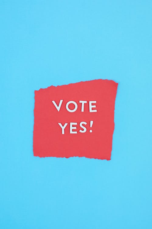 Free Vote Yes on a Red Paper Stock Photo