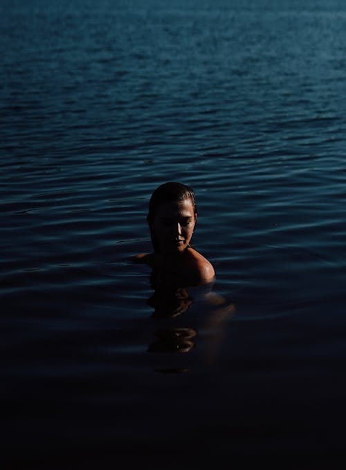 Close-Up Shot of a Woman in the Body of Water