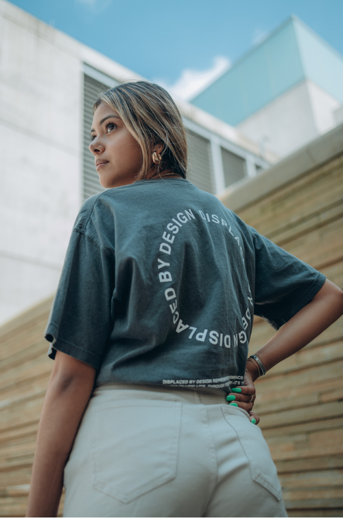 Free Fashionable young woman posing outdoors wearing a trendy T-shirt. Stock Photo