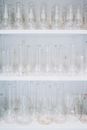 Clear Glass Bottle on White Shelf