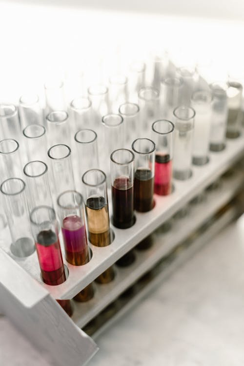 Close-up of Test Tubes with Different Color Liquids 