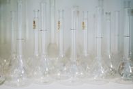 Clear Glass Bottles on White Table