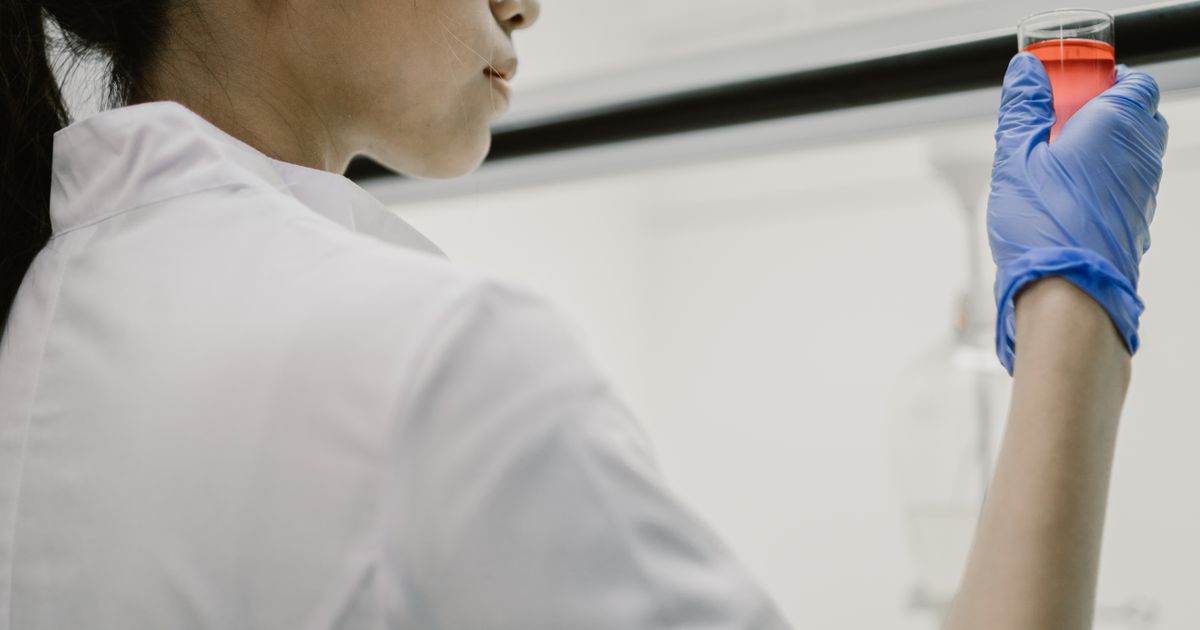 Scientist examining a sample in a laboratory
