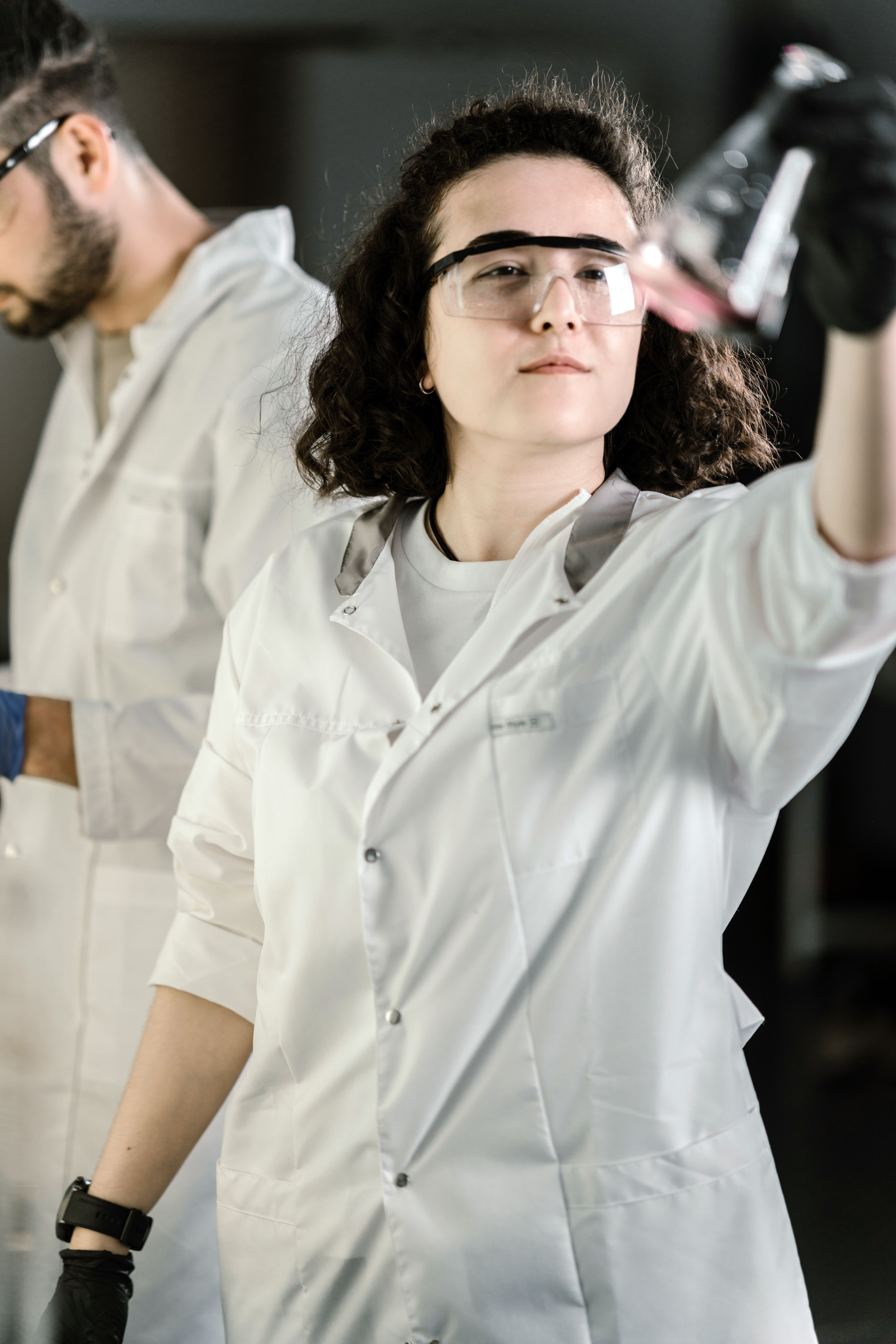 Woman Wearing Laboratory Gown Doing Experiment · Free Stock Photo