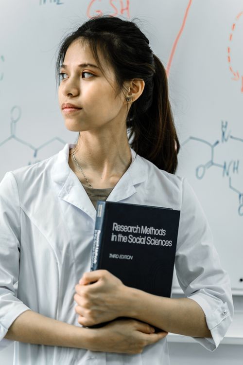 Portrait of Scientist with Book · Free Stock Photo