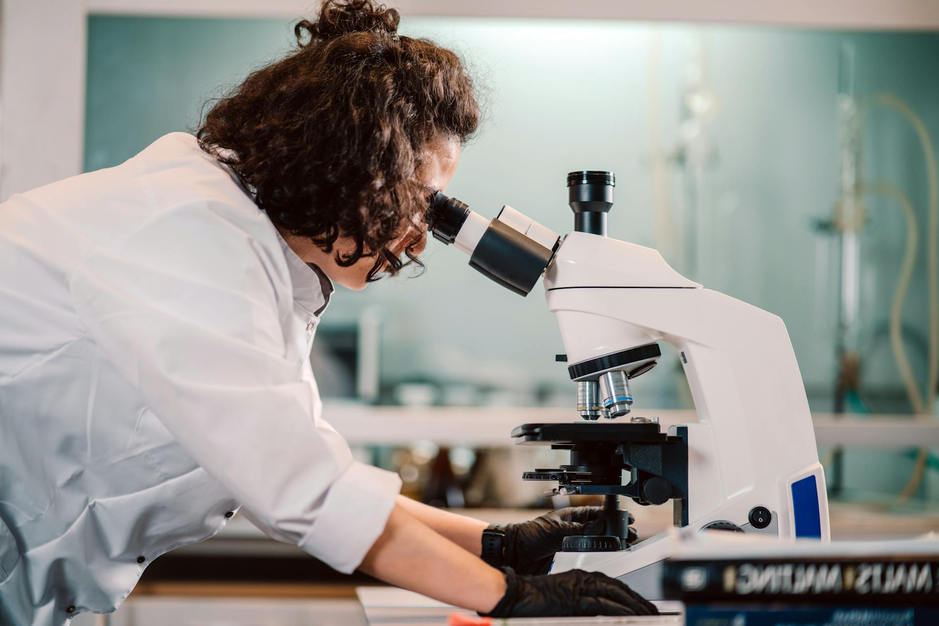 Scientist Looking through Microscope