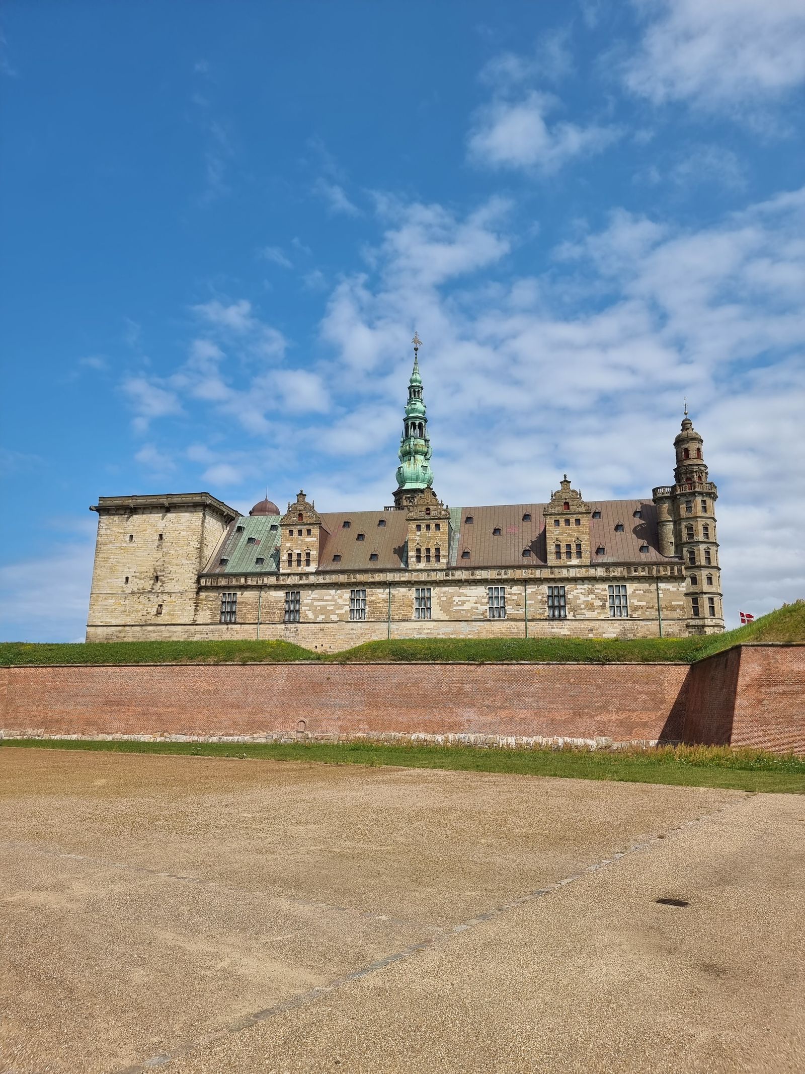 Kronborg Castle stone walls and towers under a clear blue sky in Helsingør