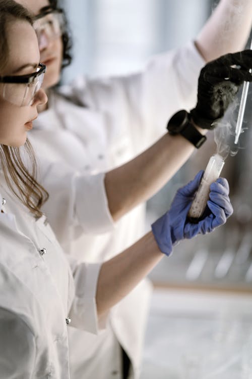 A Woman Holding a Test Tube