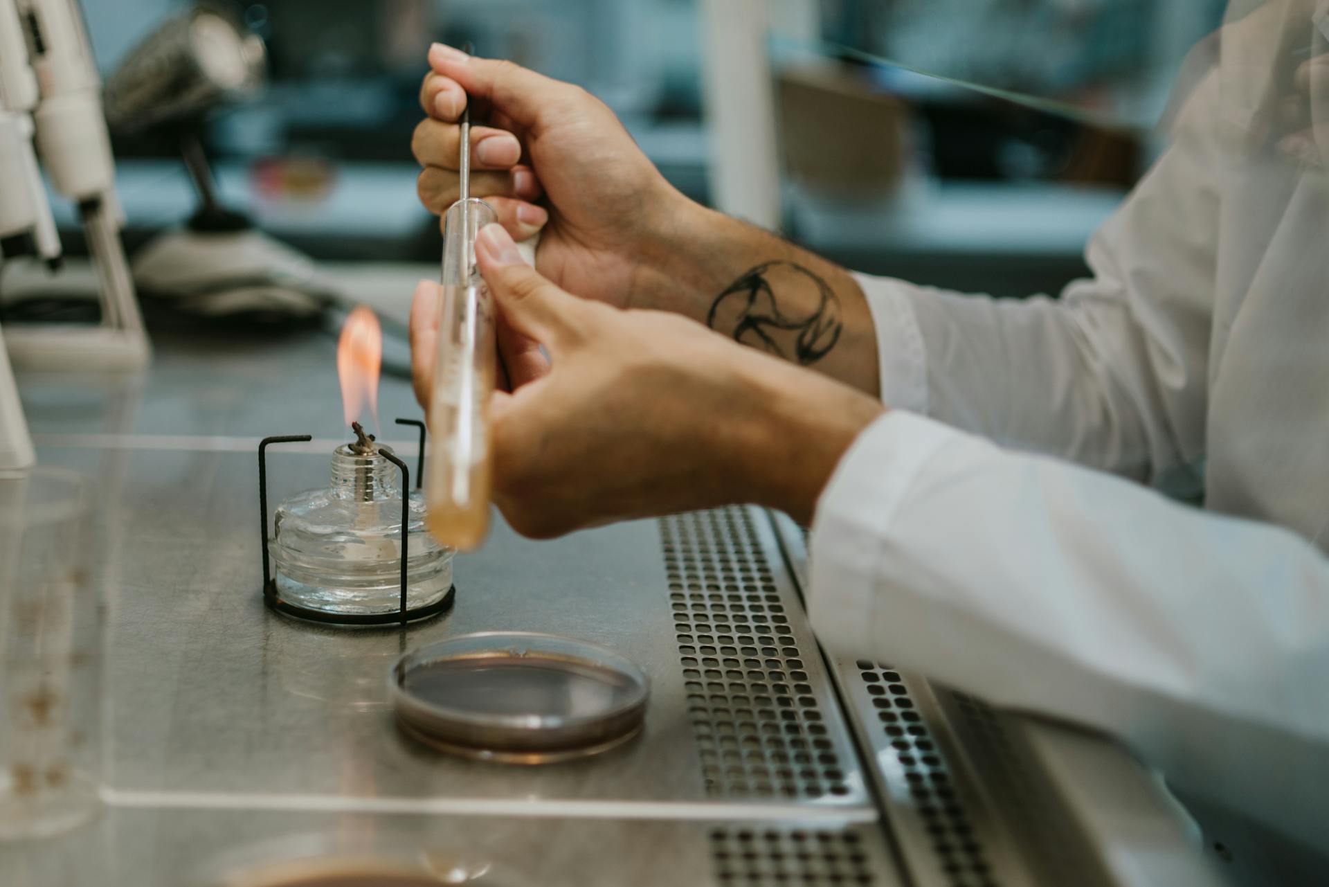 Scientist Mixing Liquid in Vial