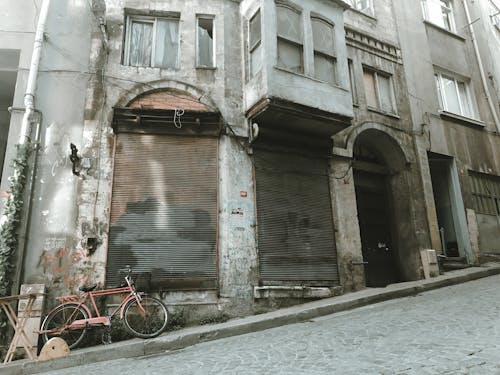 An Abandoned and Decaying Building Along The Street