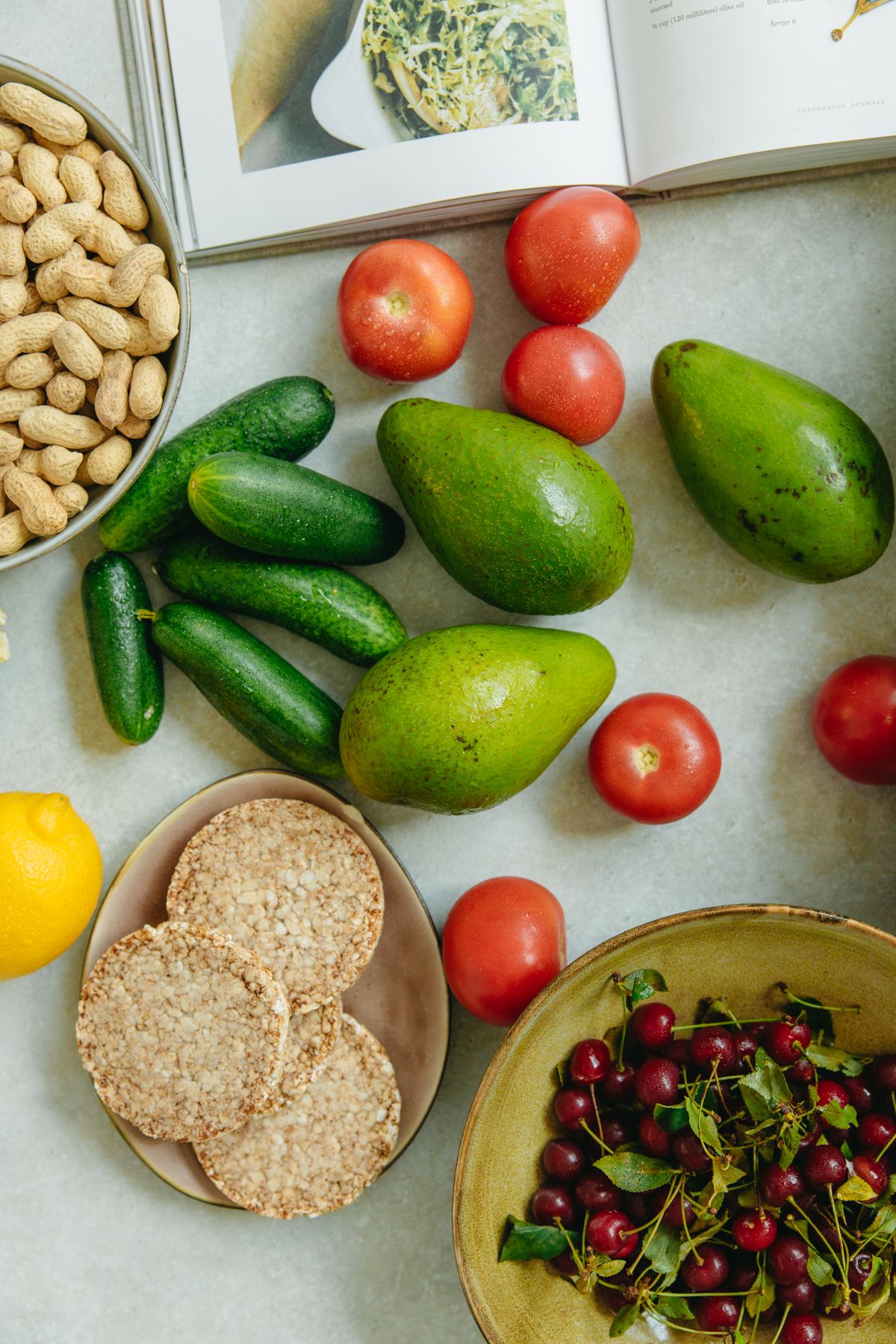 Real fruits, nuts, rice cakes, and wholesome snacks arranged on a table