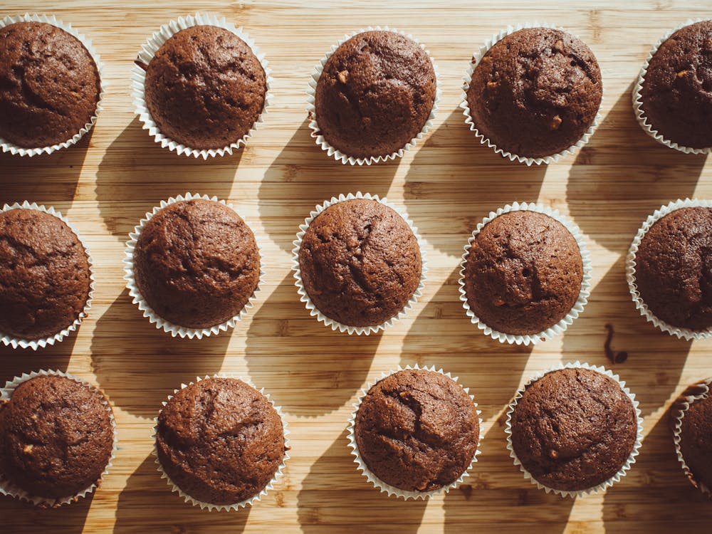 Free Chocolate Cupcakes on Brown Wooden Board Stock Photo