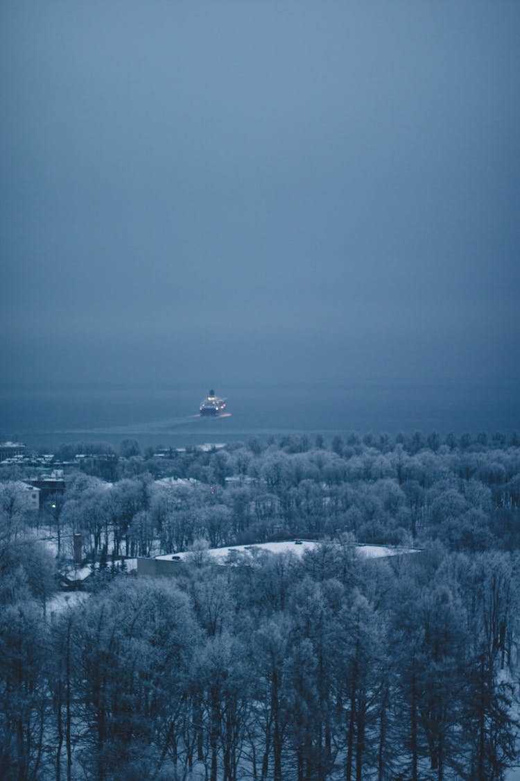 Winter Town And Ocean Liner In Hazy Distance