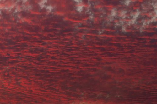 Free Stunning view of red clouds during twilight creating a dramatic sky pattern. Stock Photo