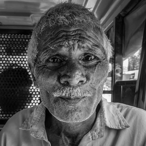 Grayscale Photo of an Old Man with Mustache