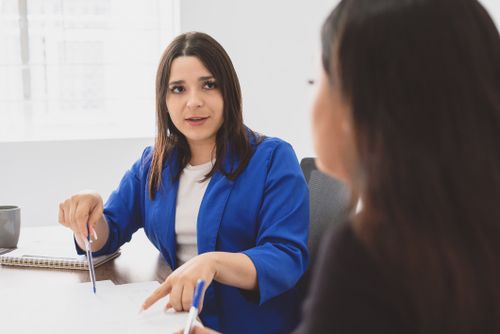 Free Two businesswomen engaging in a focused meeting, discussing work plans and strategies in an office. Stock Photo