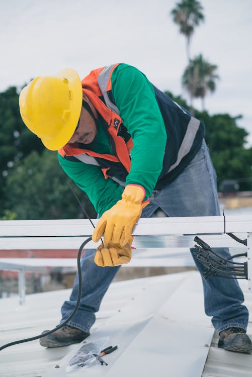 An electrical contractor wiring a building.