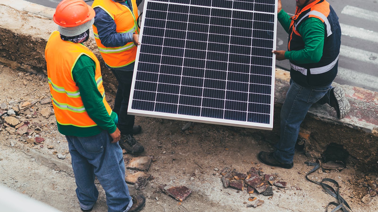 Three solar generators being tested side by side during power outage with measurement equipment